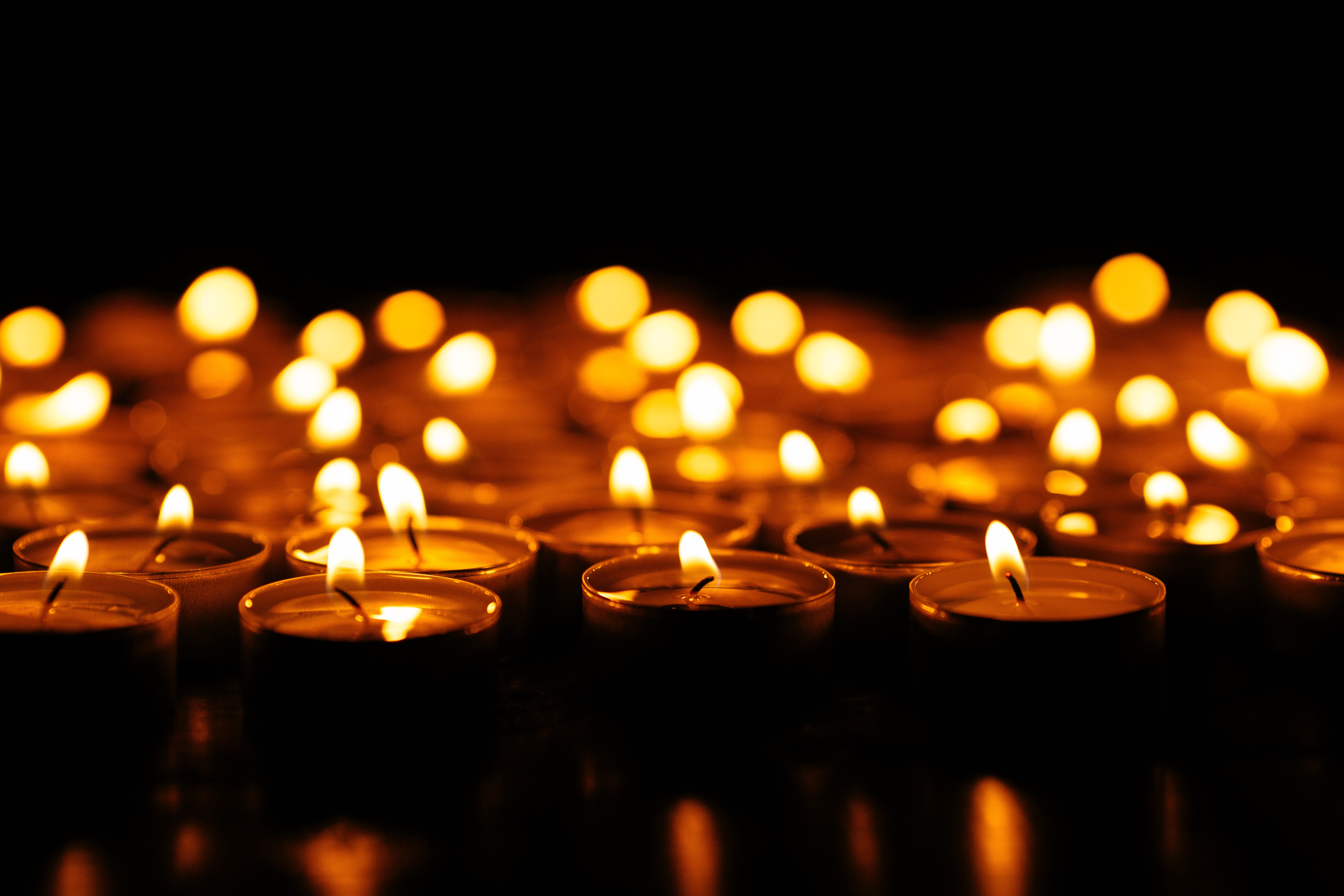 Candles. Set of lighting candles in dark. Selective focus Candles. Set of lighting candles in dark. Selective focus